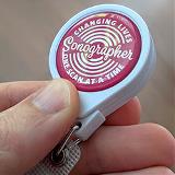 Badge-Reel_250px_inhand